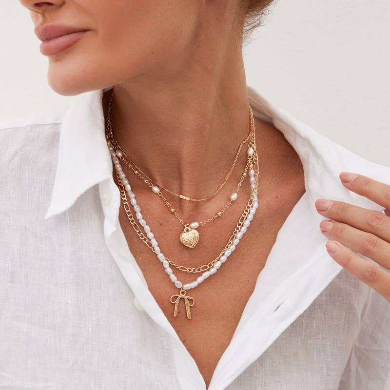 BEAUTIFUL BOW PEARL HEART PENDANT LAYERED NECKLACE |40NK9547